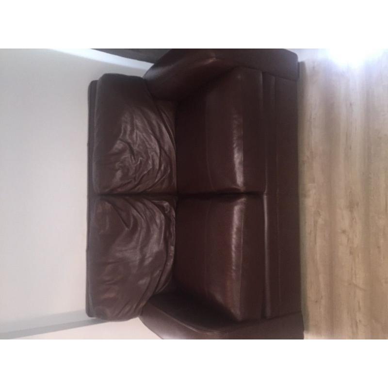 Two brown leather sofas and foot stall for sale