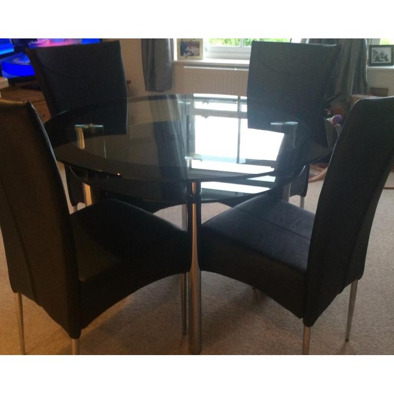 Glass Table with 4 chairs. Good Condition