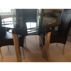 Glass Table with 4 chairs. Good Condition