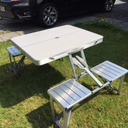 Aluminium folding table and chairs.