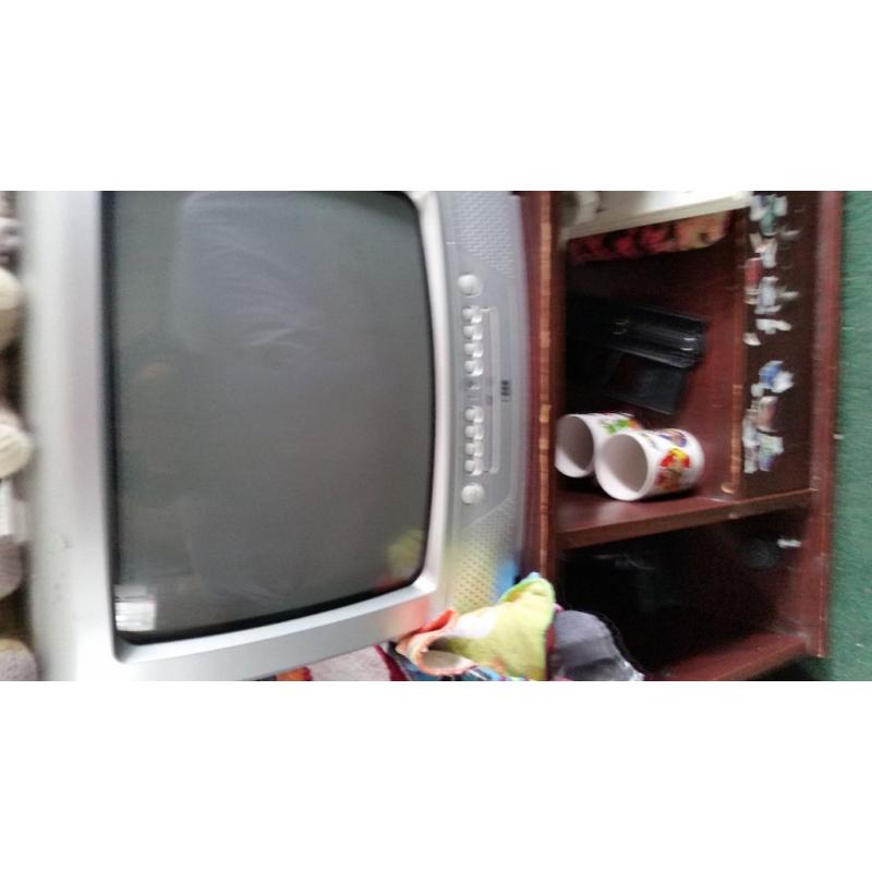 silver tv with dvv player