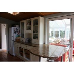 Kitchen dresser unit. Good condition with granite type worktop and breakfast bar if required.