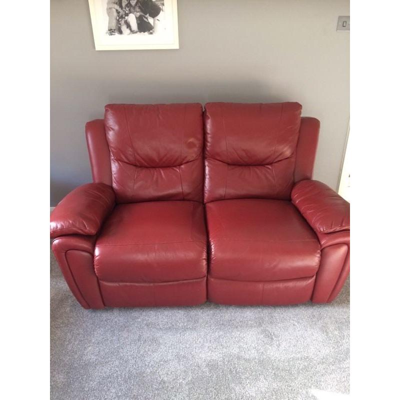 Red leather reclining sofa