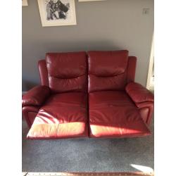 Red leather reclining sofa