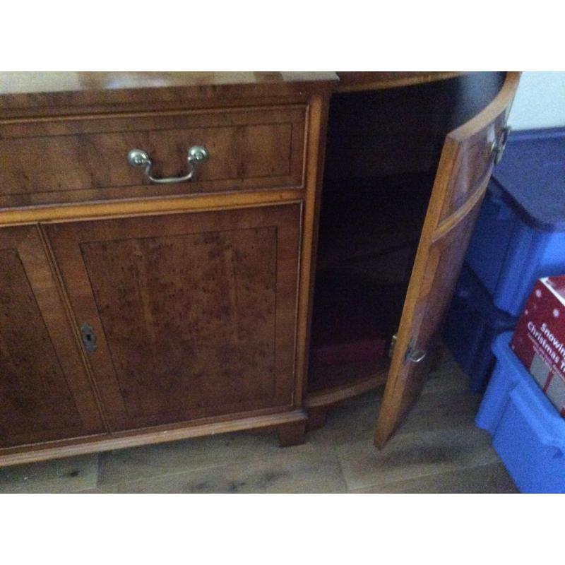 Large ornate sideboard, with angled sides.