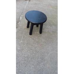 small painted black round wood stool