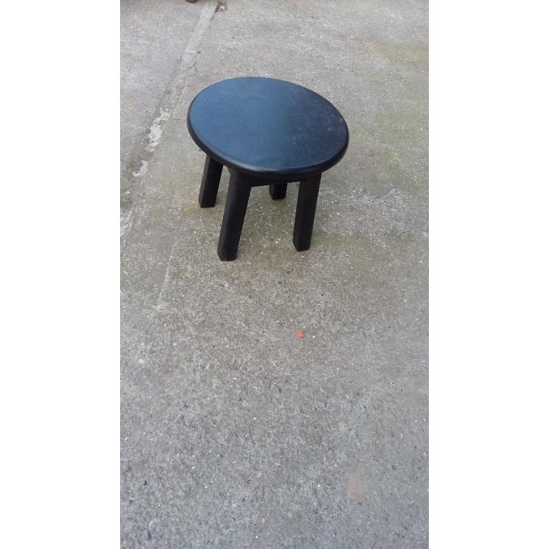 small painted black round wood stool