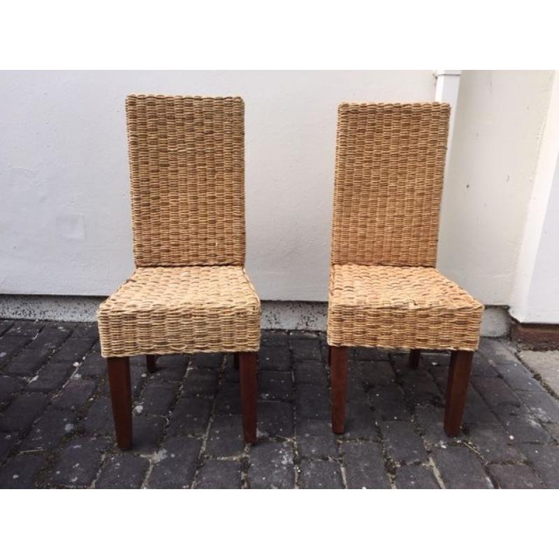 2 wicker chairs with dark wood legs. Collect from Putney