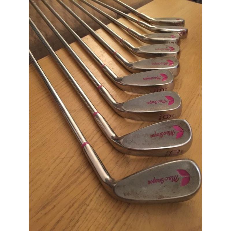 Collection of MacGregor golf clubs