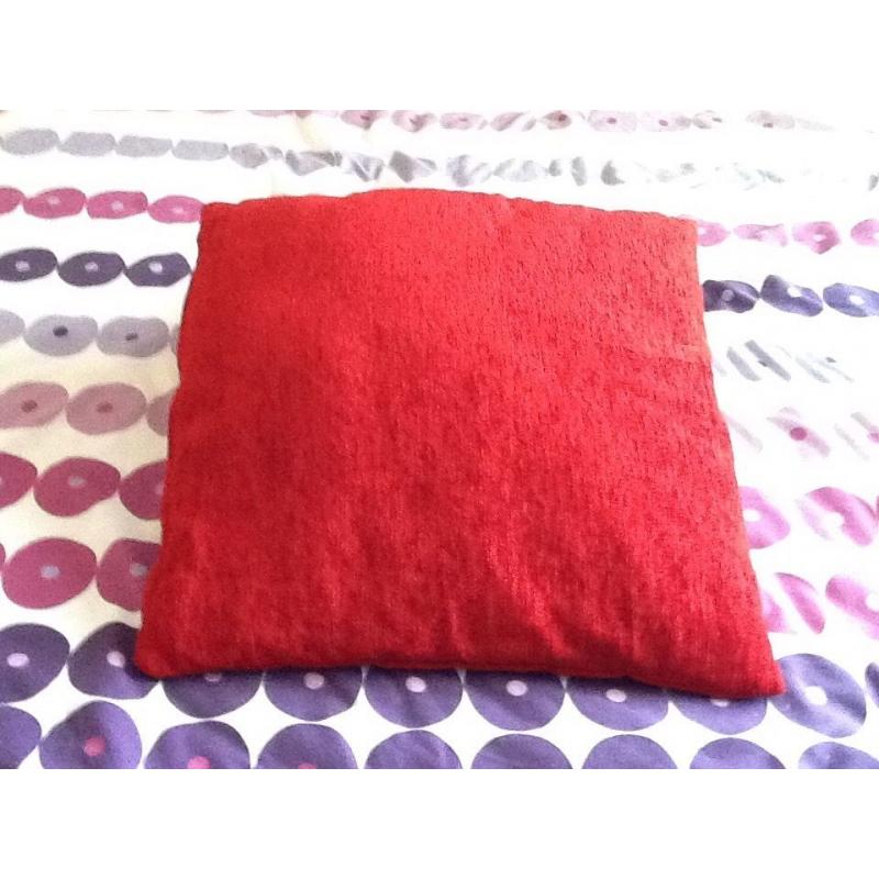 Four red cushions for sale new condition from a smoke and pet free home