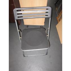 2 Folding chairs . Black colour . Plastic and metal .