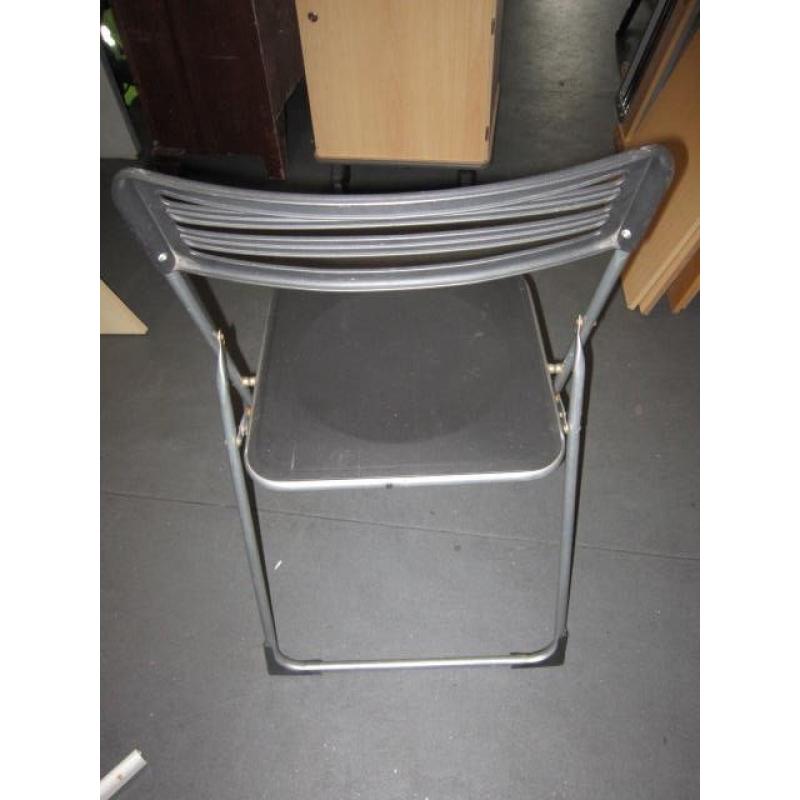 2 Folding chairs . Black colour . Plastic and metal .