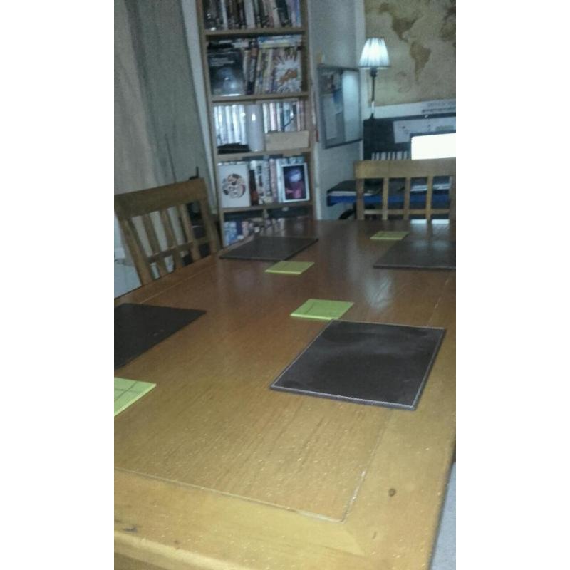 Large wooden dining table with 6 chairs. Lovely condition and quality.