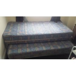 single bed with understorage guest bed and wardrobe