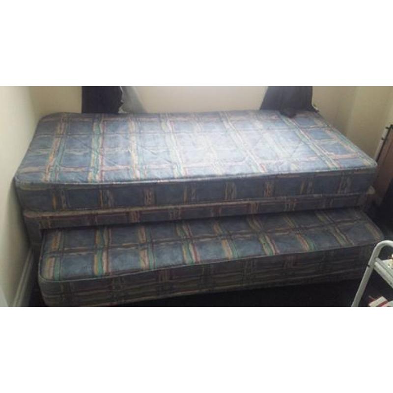 single bed with understorage guest bed and wardrobe