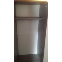 single bed with understorage guest bed and wardrobe