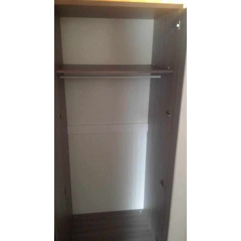 single bed with understorage guest bed and wardrobe