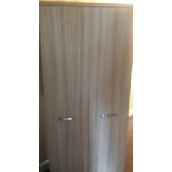 single bed with understorage guest bed and wardrobe