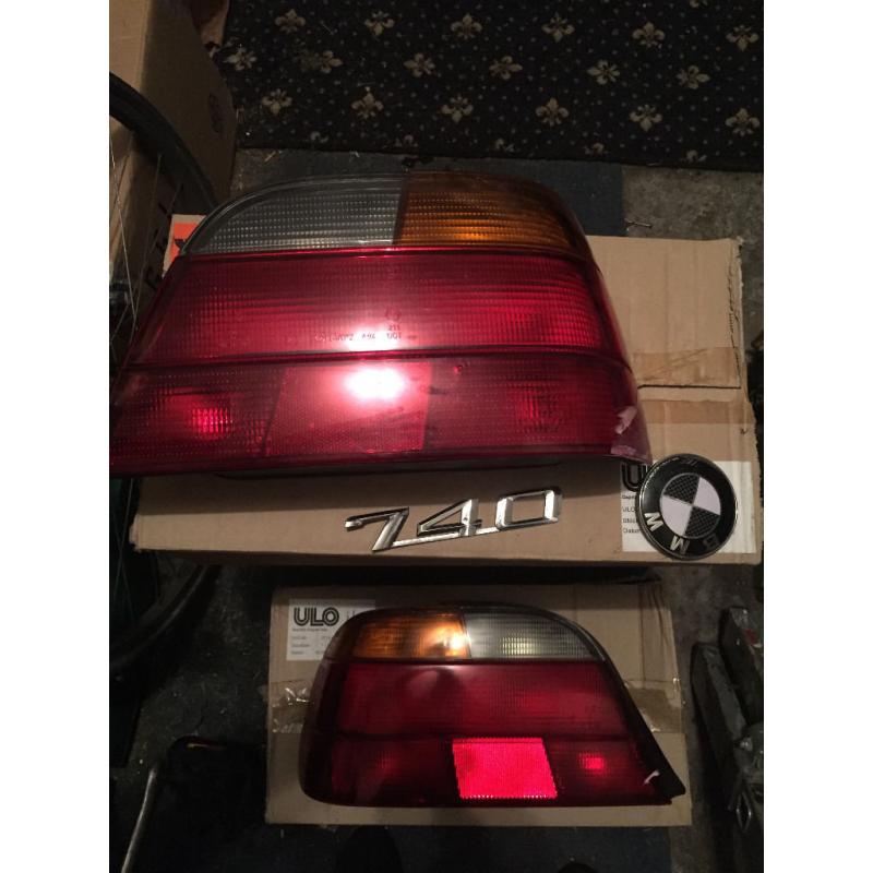 BMW 740 E38 REAR TAIL LIGHTS AND 740 BMW WHITE AND BLACK BADGE