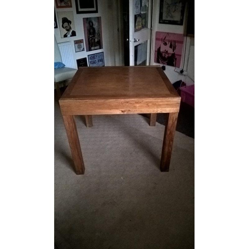 solid oak elevating dining table and chairs