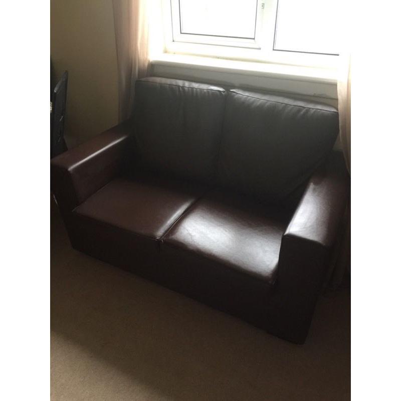 Brand new never been used brown leather two seater sofa