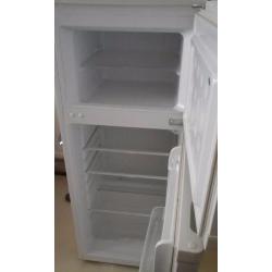 Freestanding white fridge freezer.