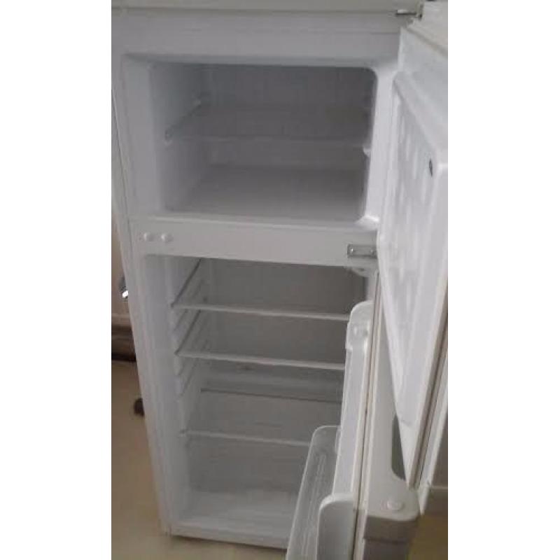 Freestanding white fridge freezer.