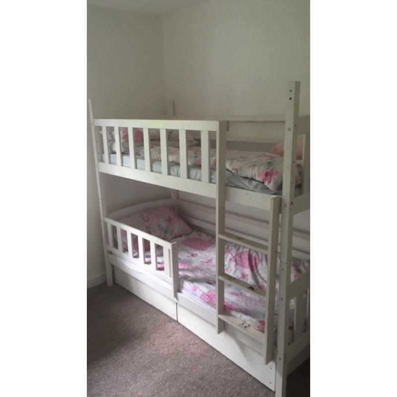 White wooden bunk beds with 2 drawers