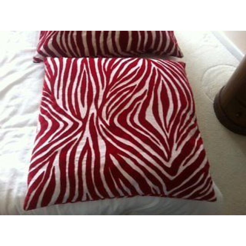 2 red zebra print cushions and red rectangle cushion