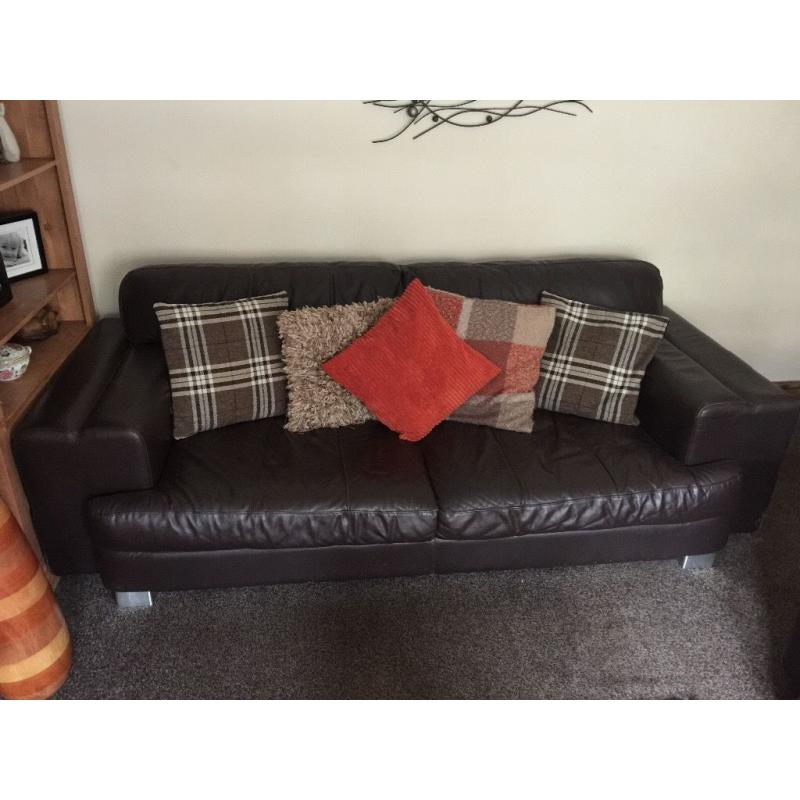 Brown real leather 3 seater, 2 seater and puffee for sale.