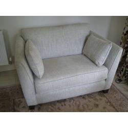 Armchair and Snuggler settee.