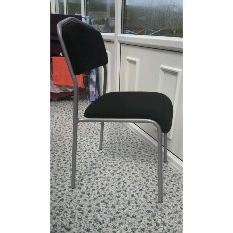 Ikea Chair in grey metal, with black upholstery.