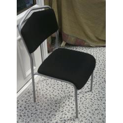 Ikea Chair in grey metal, with black upholstery.