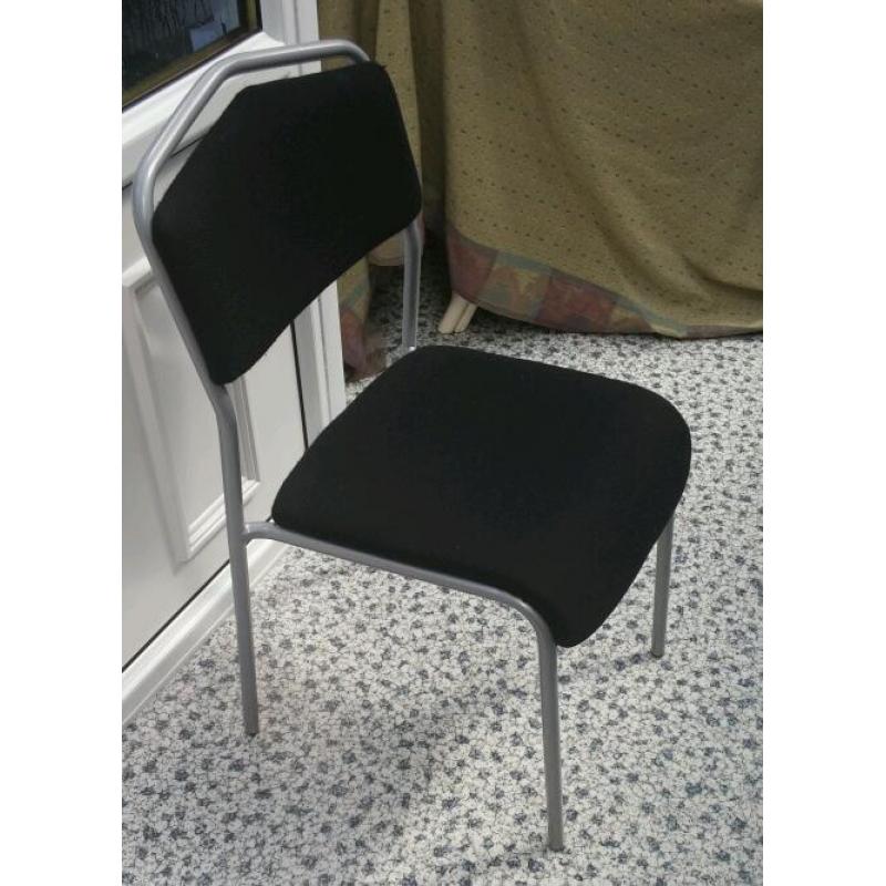 Ikea Chair in grey metal, with black upholstery.