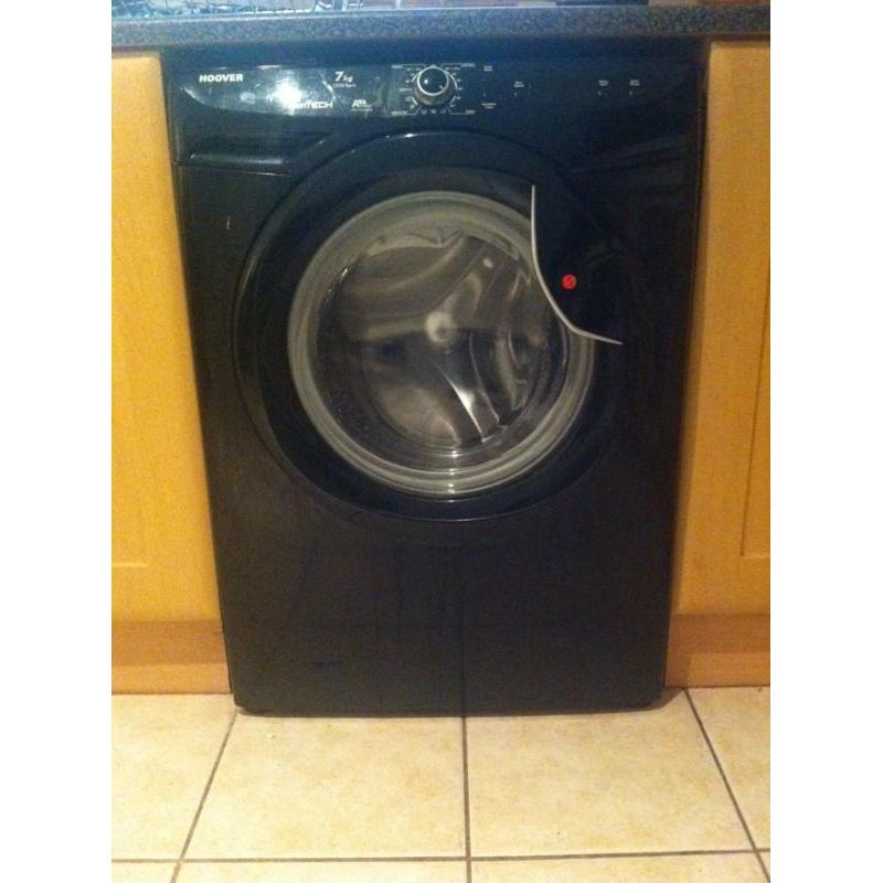 Black washing machine less than year old