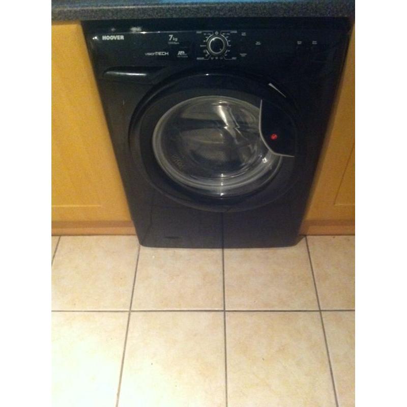 Black washing machine less than year old