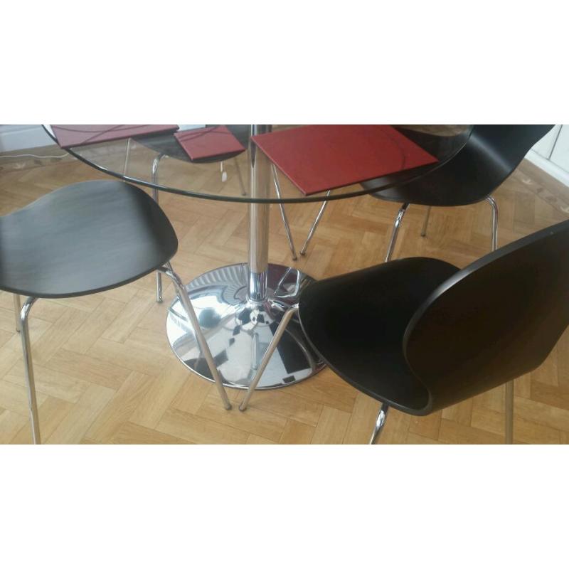 ROUND GLASS TABLE AND FOUR CHAIRS