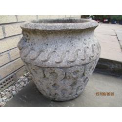 Two matching stone garden urns