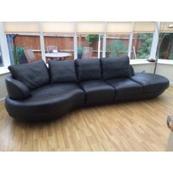 Black leather 5 seater corner sofa and footstool