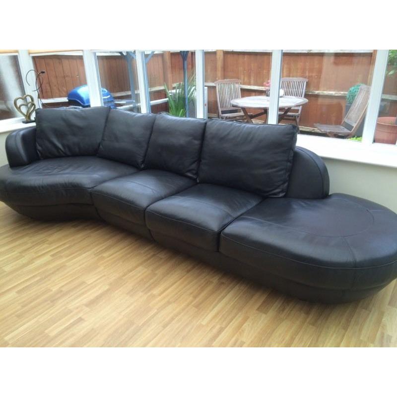 Black leather 5 seater corner sofa and footstool