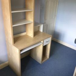 Desk with book case above and magnetic notice board