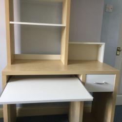 Desk with book case above and magnetic notice board