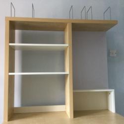 Desk with book case above and magnetic notice board