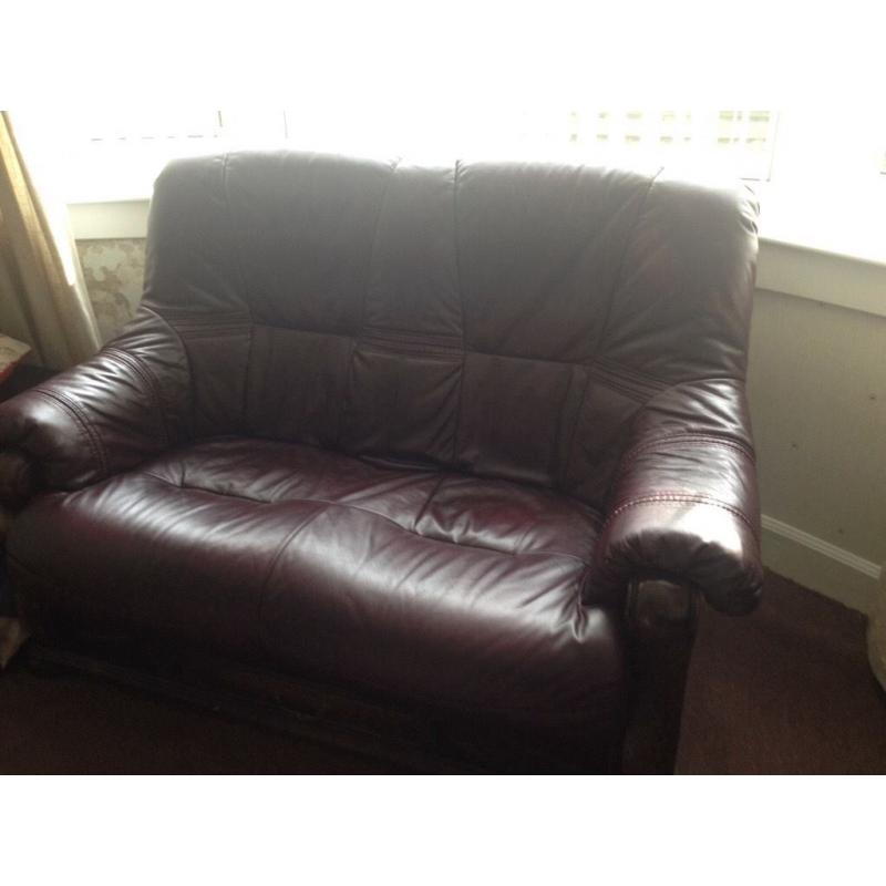 2 Two seater leather sofas plus footstool