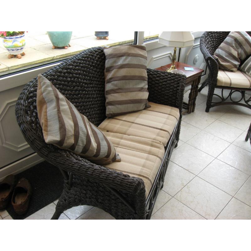 Five piece conservatory suite comprising of settee, three chairs and coffee table.