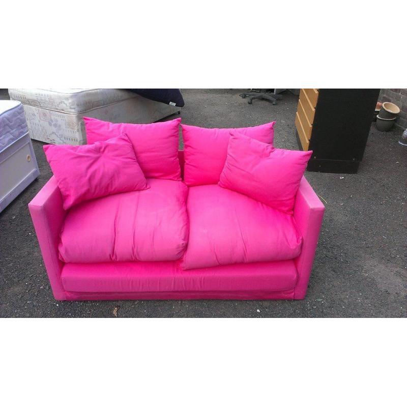 Small pink sofa bed. Good condition.