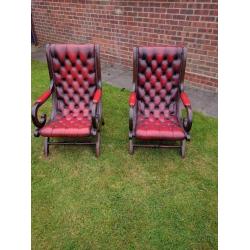 2 Chesterfield blood red leather and dark wood framed chairs in good condition for age