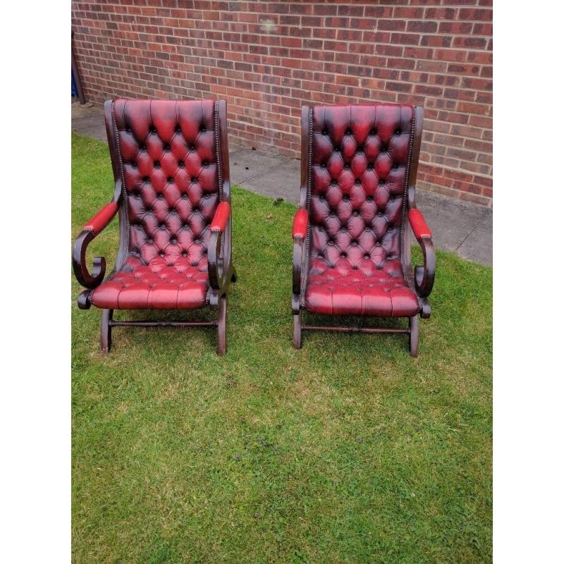 2 Chesterfield blood red leather and dark wood framed chairs in good condition for age