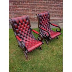 2 Chesterfield blood red leather and dark wood framed chairs in good condition for age