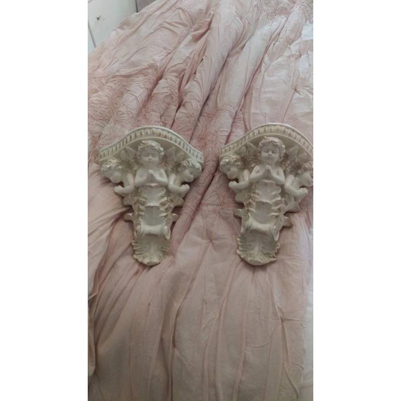 Pair of cherub wall sconces